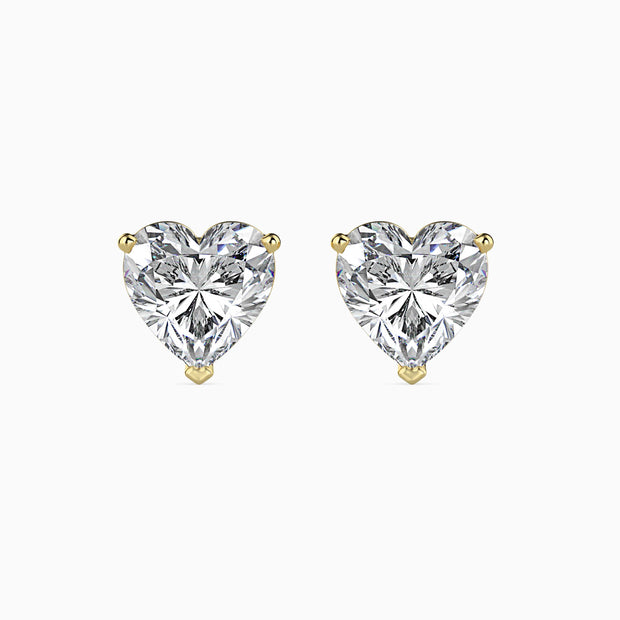 heart prong set diamond stud earrings in yellow gold