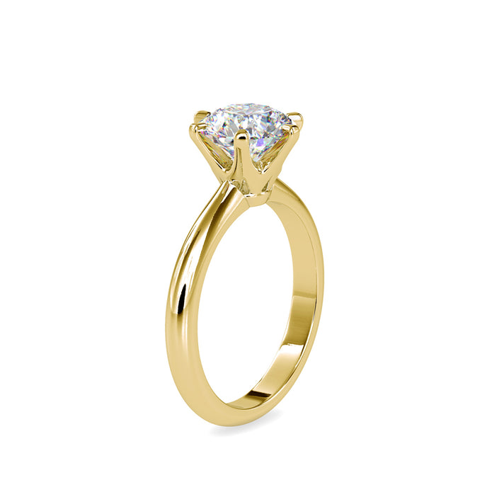 round cut solitaire diamond ring in yellow gold