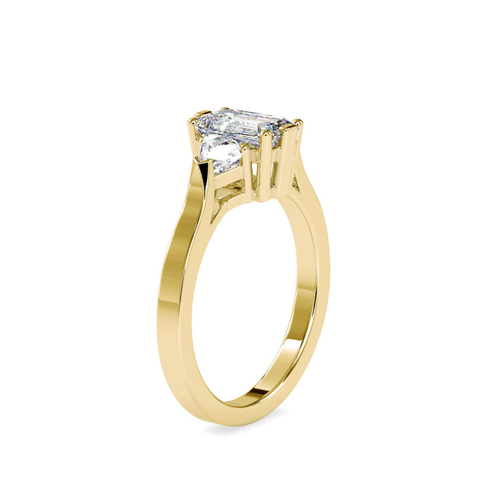 emerald cut three stone lab-grown diamond ring in yellow gold