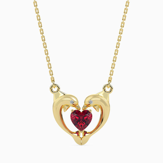 dolphin embrace red heart diamond necklace in yellow gold